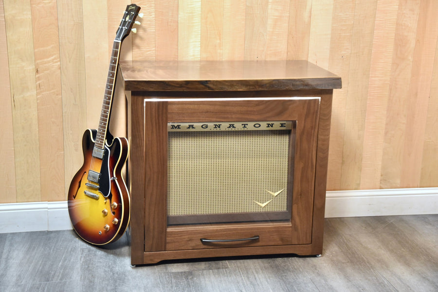 Walnut Amp Cabinet closed with a Magnatone amplifier inside and a Gibson guitar leaning against it
