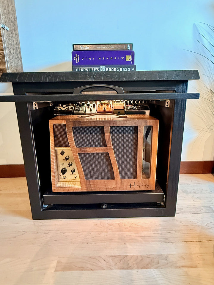 Koa framed interior of the black Amp Cabinet with a Humphrey amplifier