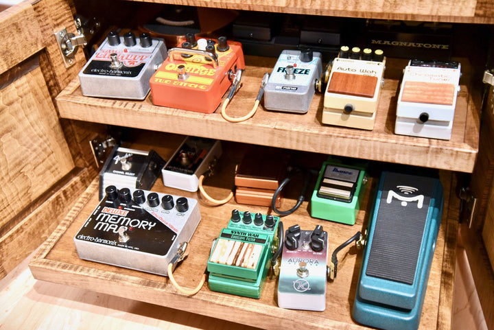 Both roll-out shelves loaded with a full effects pedal chain