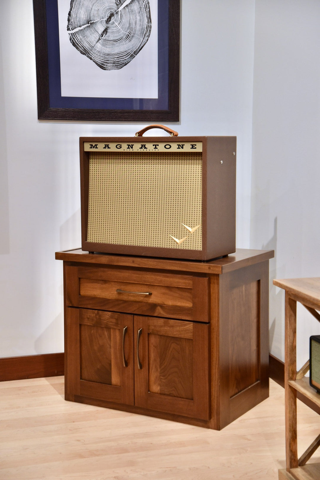 Cherry Amp Stand with amplifier on top in a room setting