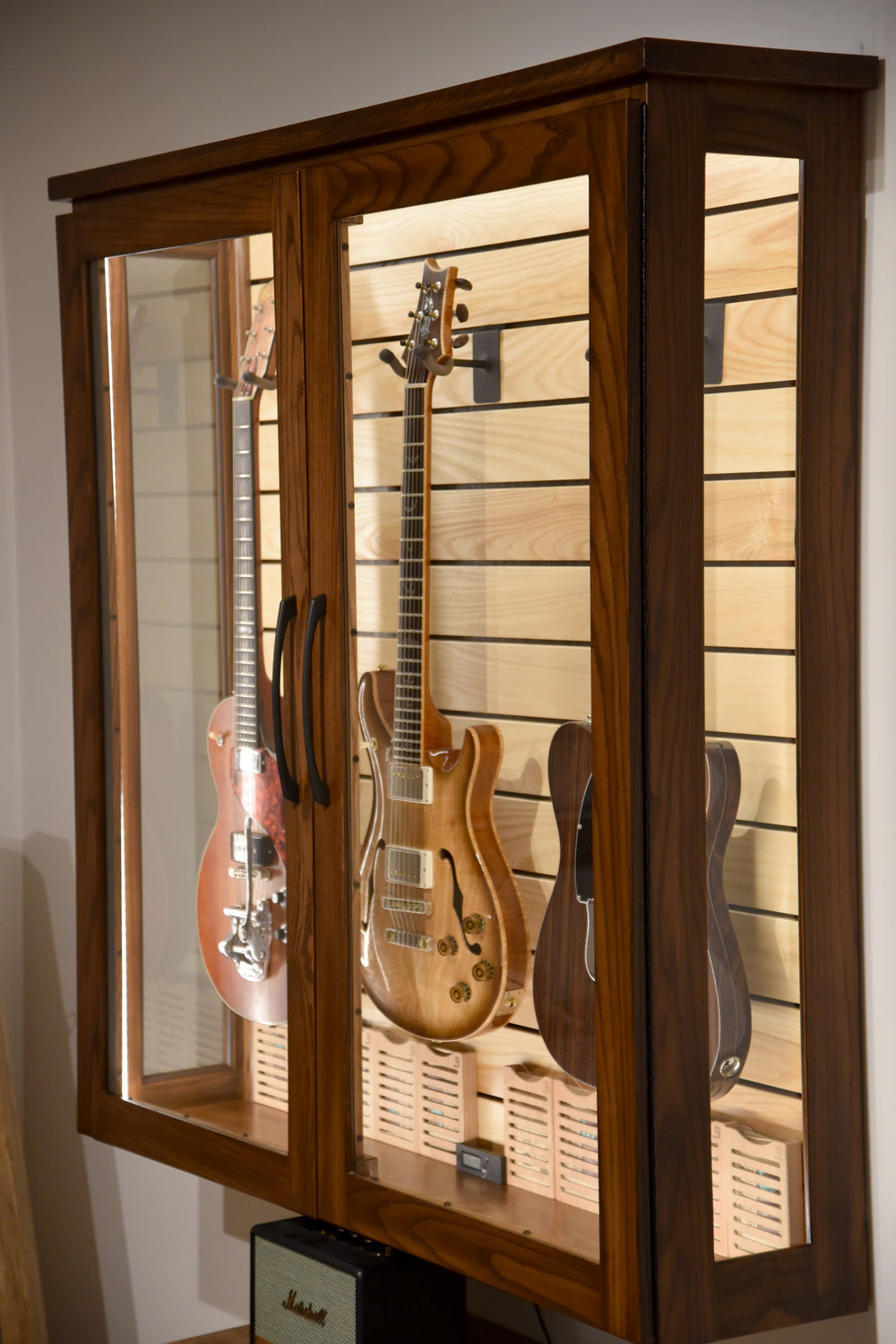 ClimaCase Duo holding three guitars