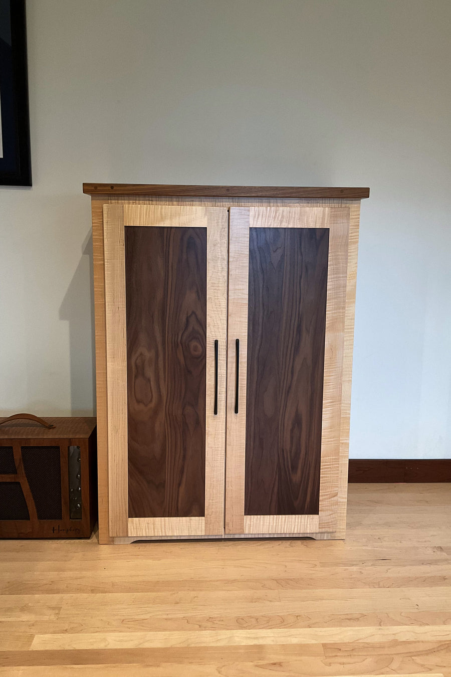 Effects Rack Cabinet in flamed maple with walnut door panels, doors closed
