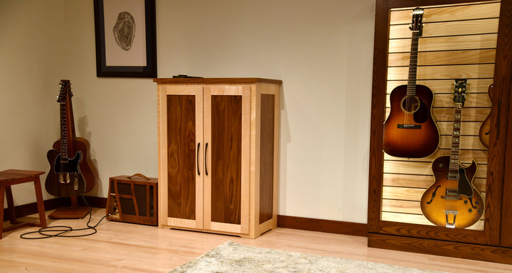 Effects Rack Cabinet in a music room beside a wall of displayed guitars