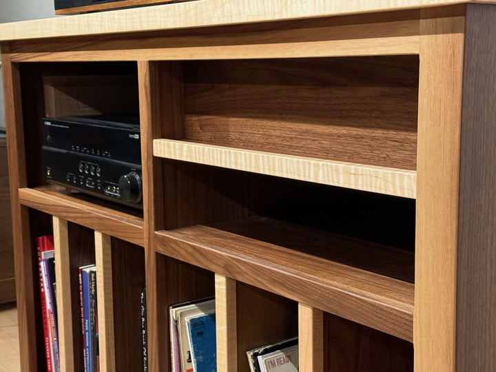 Open component bay of the Record Console holding a stereo receiver