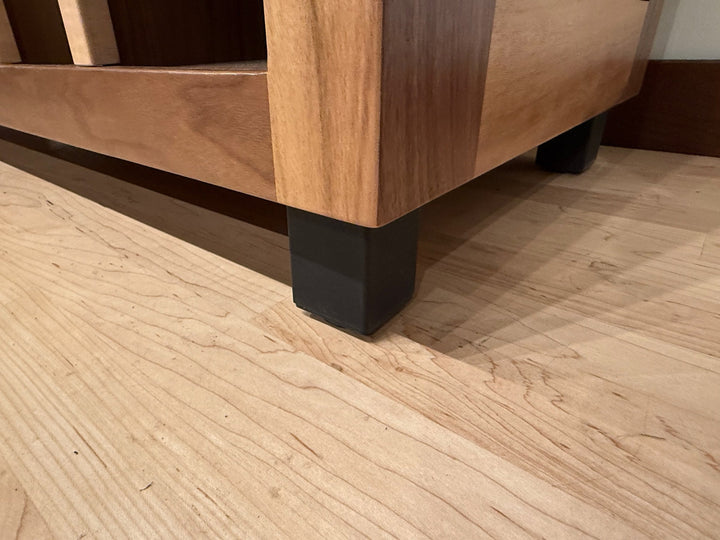 Close view of the Record Console foot and the two-tone hardwood carcase