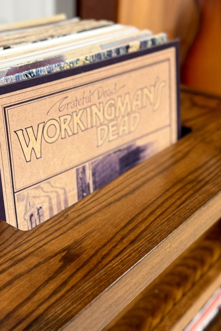Detail of the ash and coffee stain Record Console with the turntable on top