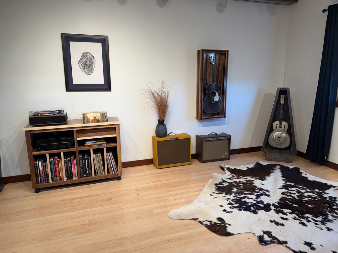 The ash Record Console in a room with a cowhide rug