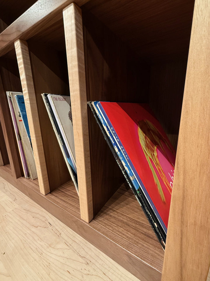 Records standing square and supported between the dividers